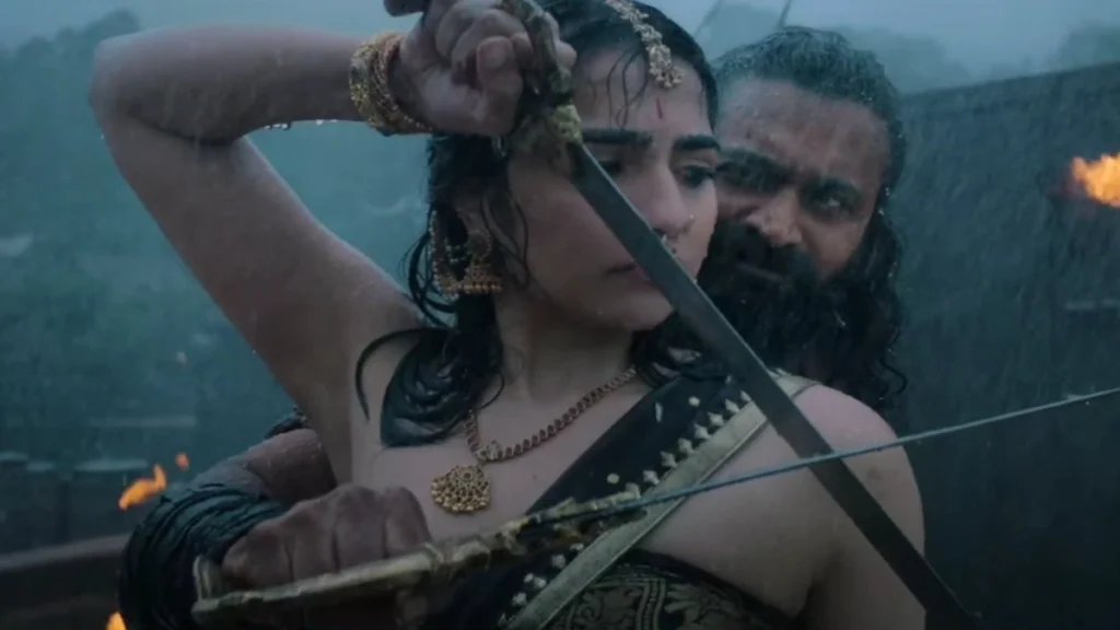 Rishabh Shetty and Rukmini Vasanth learning the sword in a scene from Kantara Chapter 1